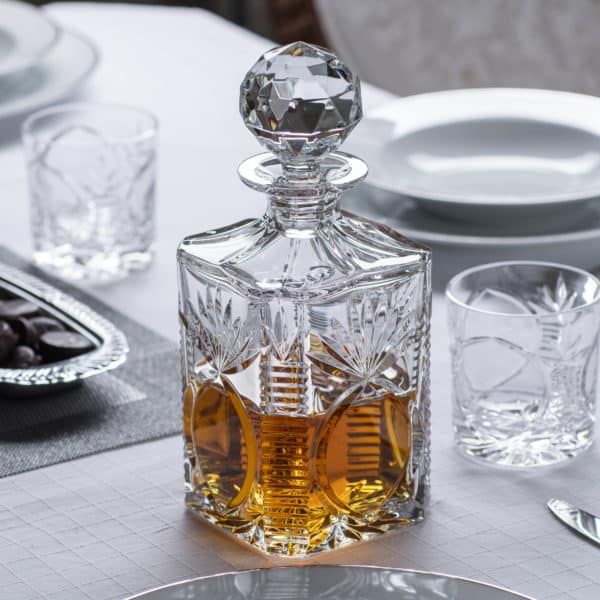 Glencairn Crystal The <a href="https://glencairn.co.uk/product-category/collections/bothwell">Bothwell</a> collection features an incredibly traditional yet elegant hand cut pattern on high quality mouthblown crystal and was the first glassware range to emerge during the early days of Glencairn Crystal. Accompanied by two <a href="https://glencairn.co.uk/product/bothwell-whisky-tumbler">Bothwell Whisky Tumblers</a>, the square decanter beautifully stores your whisky whilst being a lavish statement piece for your home. Supplied in a luxurious navy gift box lined with navy satin, this Bothwell decanter set is a wonderful whisky gift for loved ones or for a very special occasion.